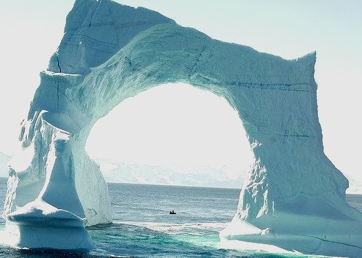 by francois Dequidt on Flickr.Floating arch iceberg in the waters of Greenland.
