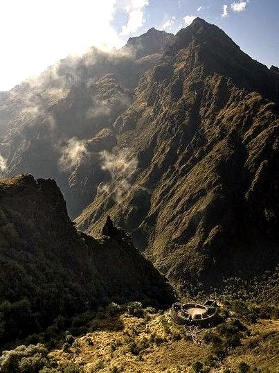 The ruins of Runkurakay sit on a hill between mountain ridges, The Inca Trail, Peru