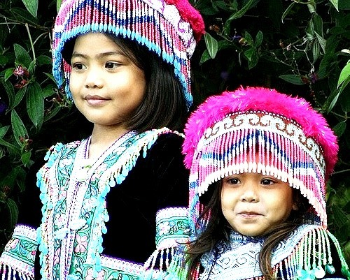 Little sisters in hilltribe costumes in Chiang Mai, Thailand